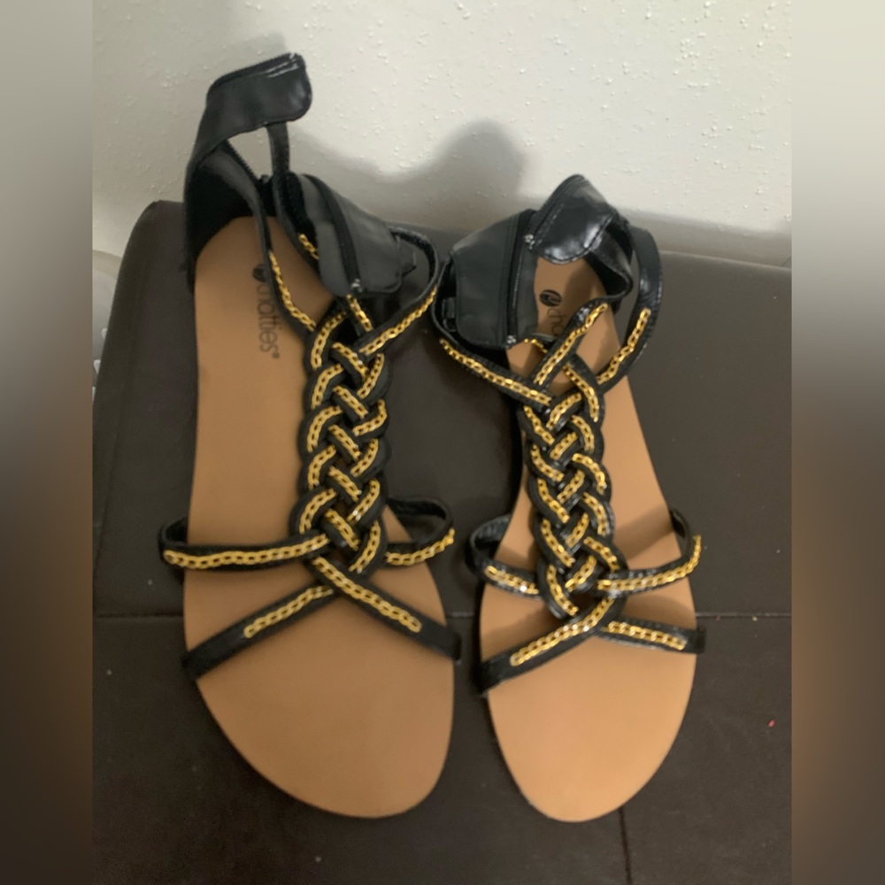 Black Sandals with Gold Detailing